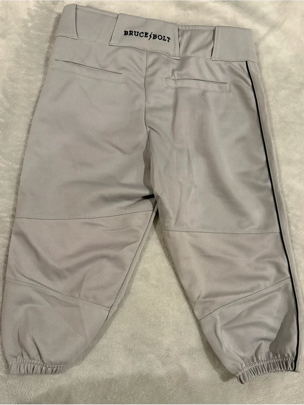 Bruce Bolt youth XL Light Gray Baseball Pants with Black Lightning Detail